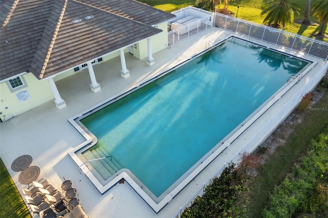 view of swimming pool featuring a patio area