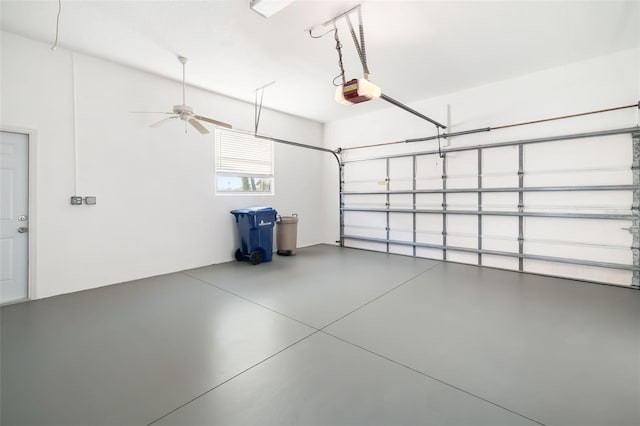 garage featuring ceiling fan and a garage door opener