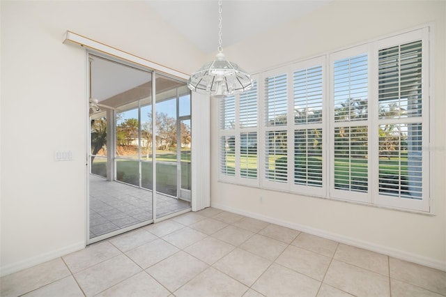 unfurnished sunroom with a notable chandelier