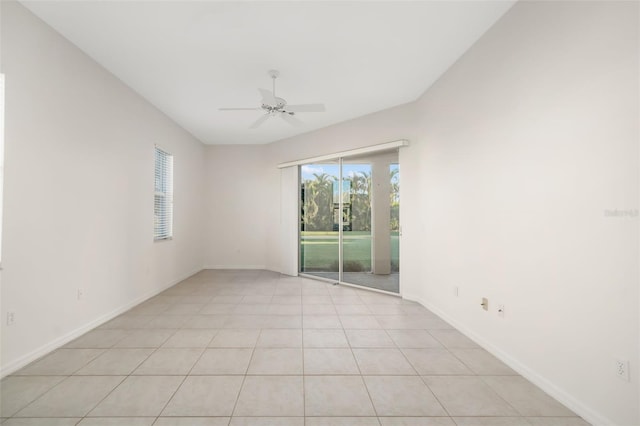 tiled empty room with ceiling fan