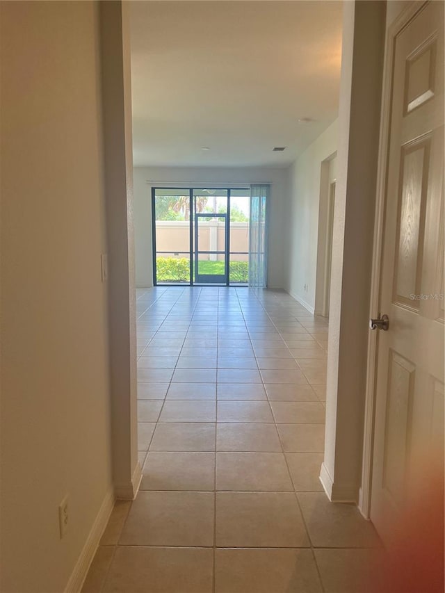 hallway with light tile floors