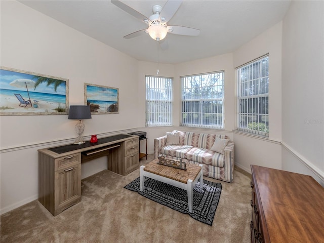 office area with light colored carpet and ceiling fan