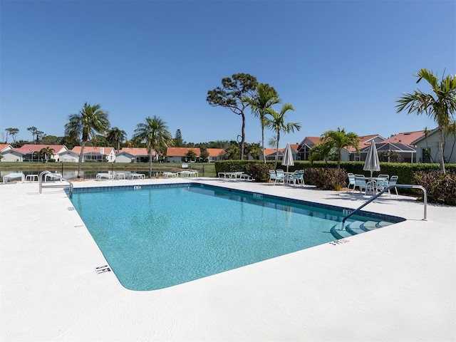 view of swimming pool with a patio