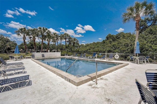 view of swimming pool with a patio area