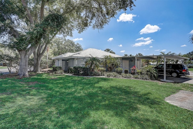 single story home with a carport and a front yard