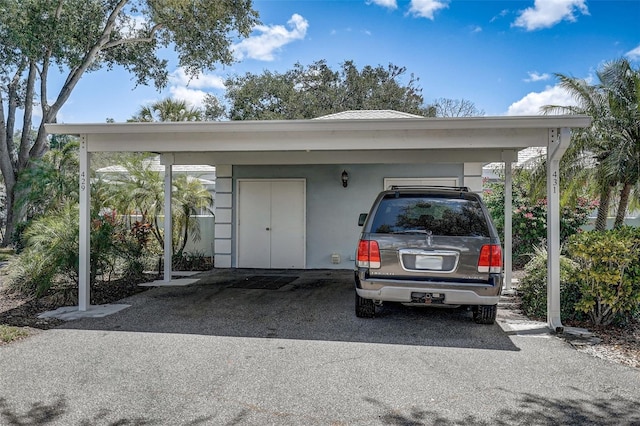 view of parking featuring a carport