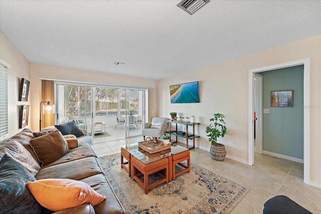 tiled living room with a textured ceiling