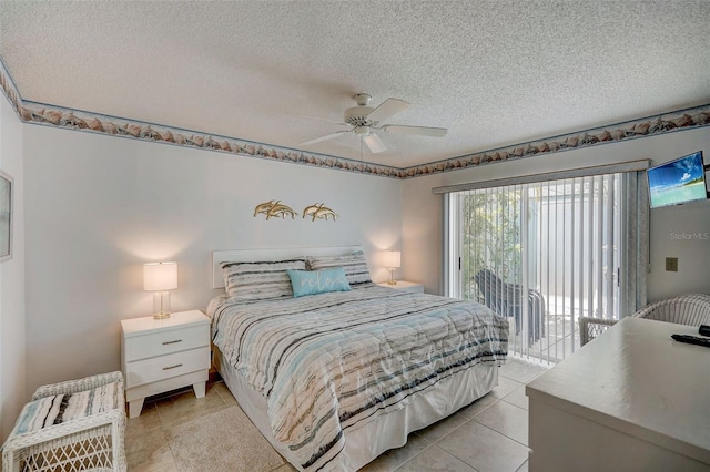 tiled bedroom featuring ceiling fan, access to outside, and a textured ceiling