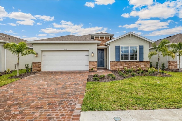 view of front of house with a garage and a front lawn