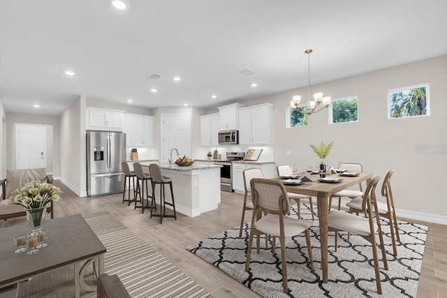 dining space with a chandelier