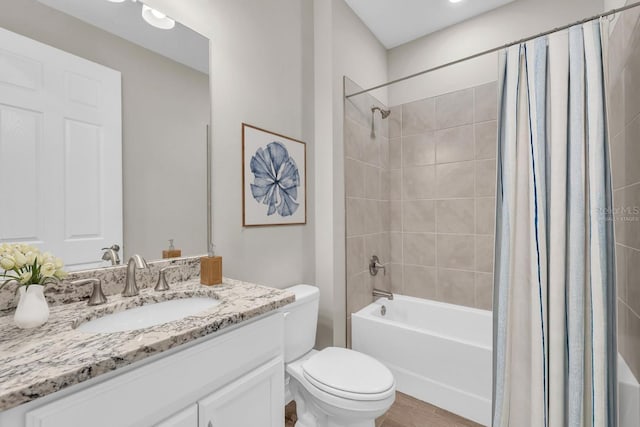 full bathroom featuring toilet, vanity, shower / tub combo, and hardwood / wood-style flooring