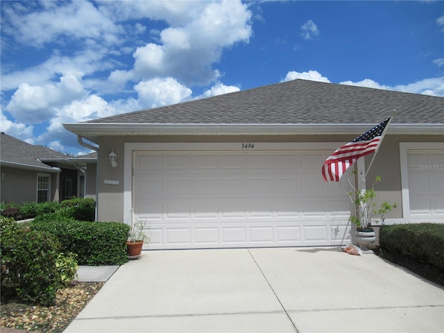 ranch-style house featuring a garage