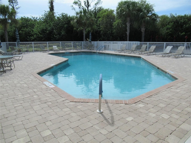 view of swimming pool featuring a patio