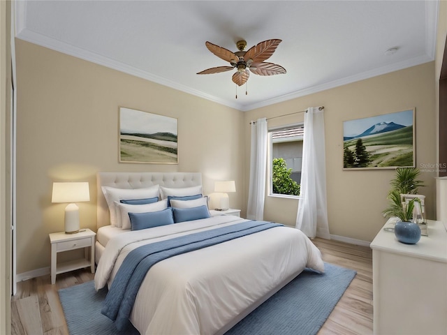 bedroom featuring ceiling fan, crown molding, and light wood-type flooring