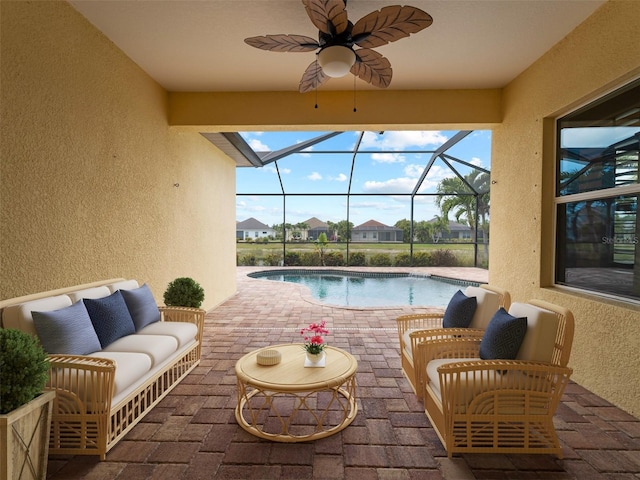 view of patio featuring ceiling fan, a lanai, and an outdoor hangout area