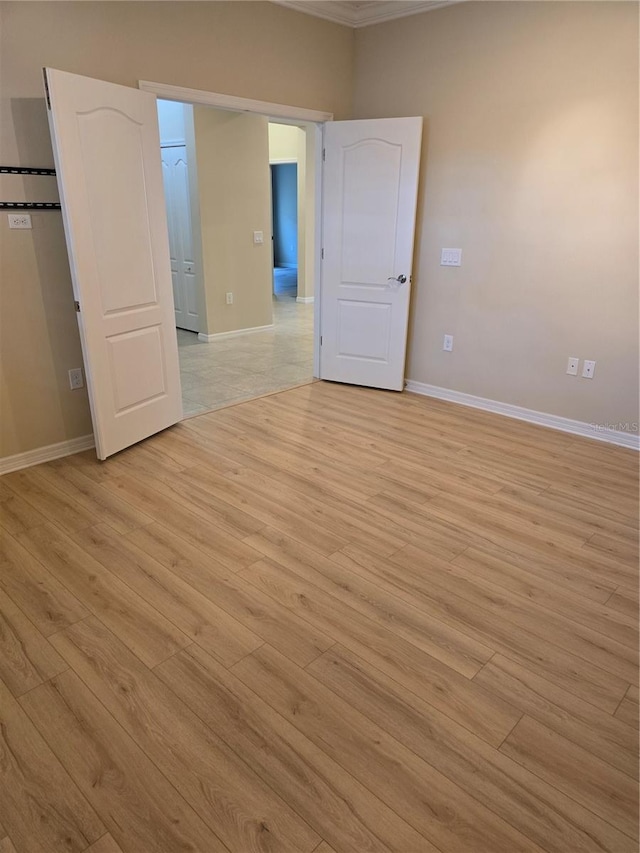 unfurnished bedroom with light wood-type flooring