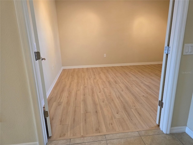 empty room with light hardwood / wood-style flooring