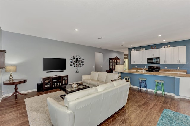 living room with dark hardwood / wood-style floors