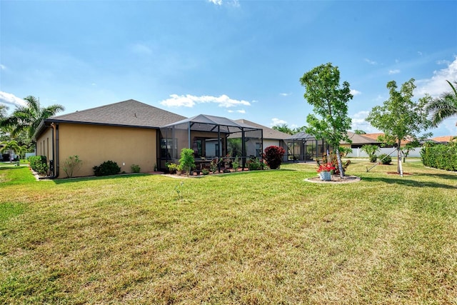 exterior space featuring glass enclosure and a lawn