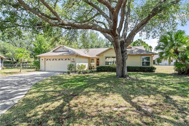 ranch-style home featuring a front lawn and a garage