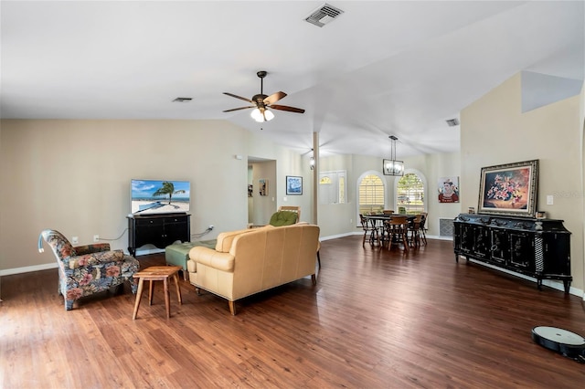 living room featuring lofted ceiling, ceiling fan with notable chandelier, and dark hardwood / wood-style floors