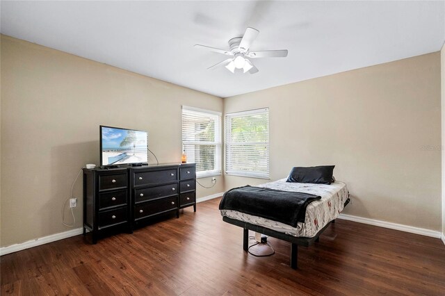 bedroom featuring ceiling fan and dark wood-type flooring