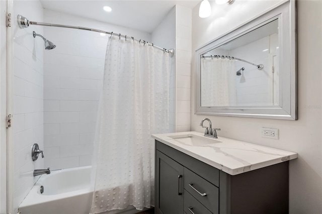 bathroom featuring vanity and shower / bath combo with shower curtain