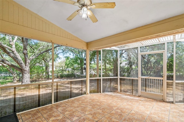 unfurnished sunroom featuring ceiling fan and vaulted ceiling