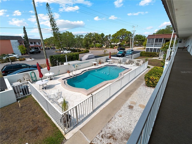 view of swimming pool with a patio