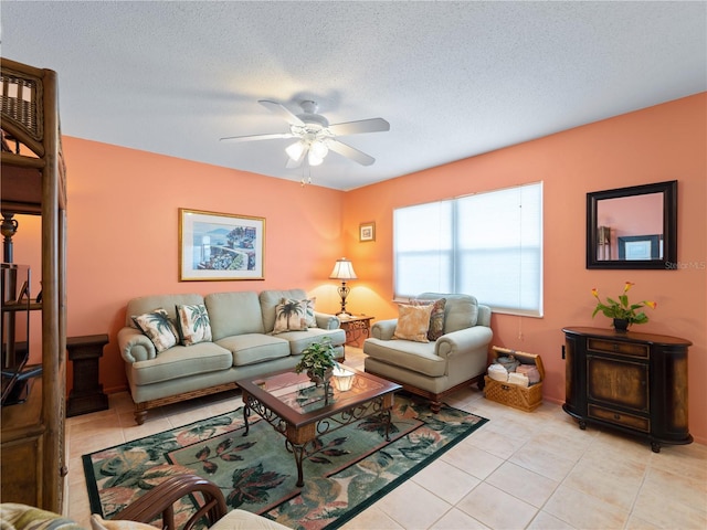 tiled living room with a textured ceiling and ceiling fan