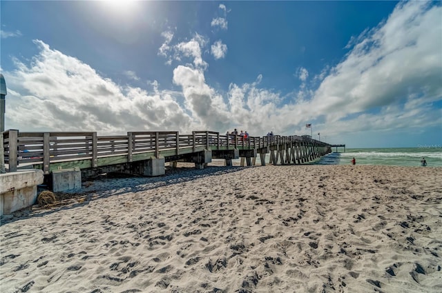 exterior space with a beach view and a water view