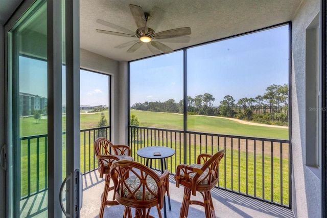 sunroom / solarium with ceiling fan