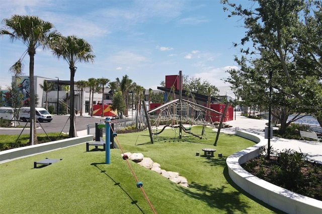 surrounding community with a playground and a lawn