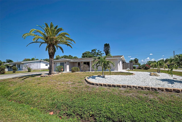 ranch-style house with a front yard