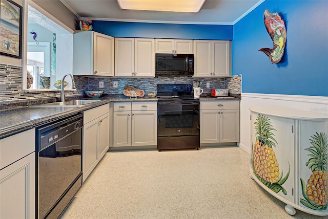 kitchen featuring decorative backsplash, sink, black appliances, and ornamental molding