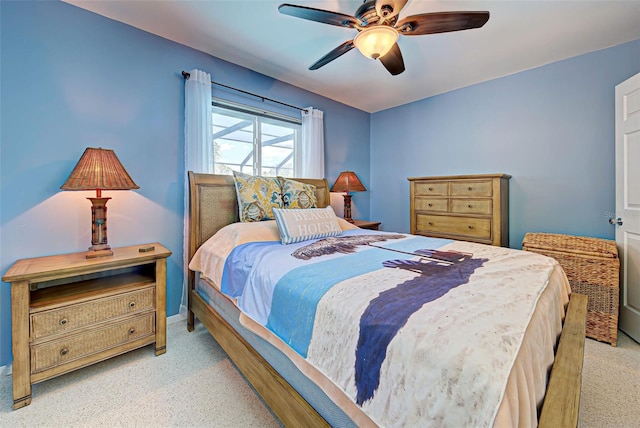 bedroom featuring ceiling fan and light colored carpet