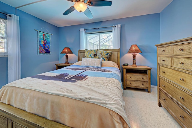 bedroom featuring ceiling fan and light colored carpet