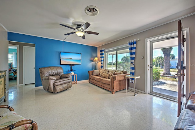 living room with ceiling fan and crown molding