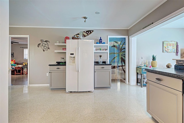 kitchen with white refrigerator with ice dispenser and ornamental molding