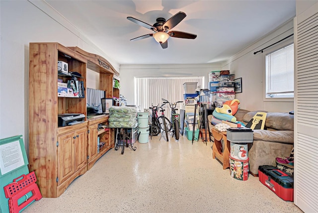 office with ceiling fan and crown molding