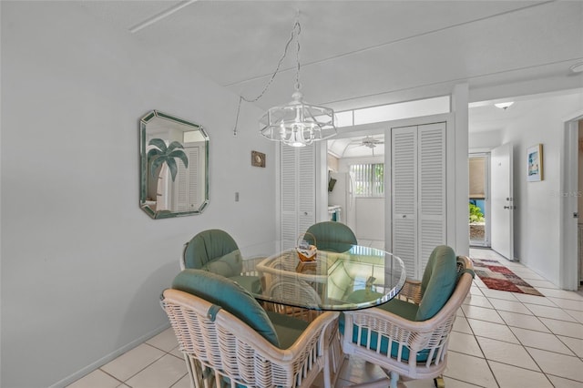 tiled dining area featuring ceiling fan