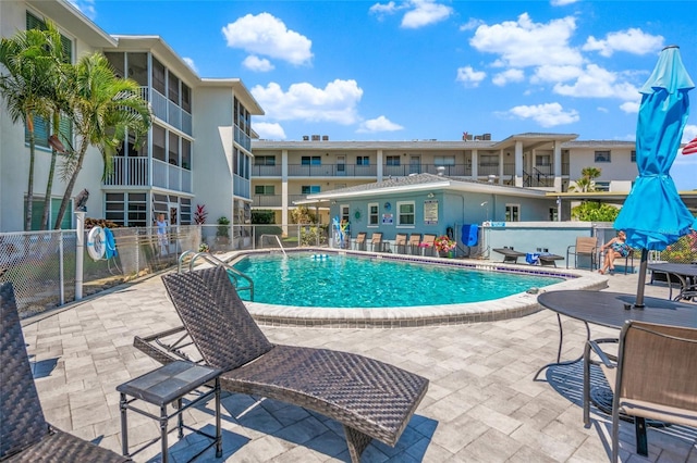 view of swimming pool featuring a patio area