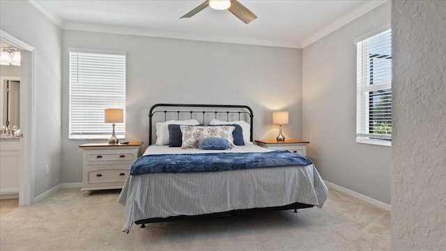 carpeted bedroom featuring ceiling fan and ornamental molding