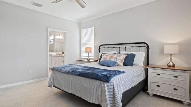 bedroom with crown molding, ensuite bathroom, ceiling fan, and light colored carpet