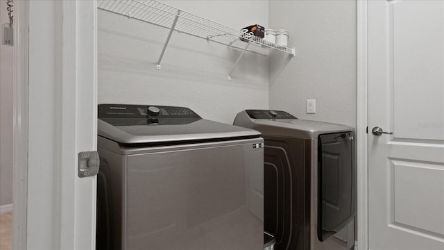 washroom featuring separate washer and dryer