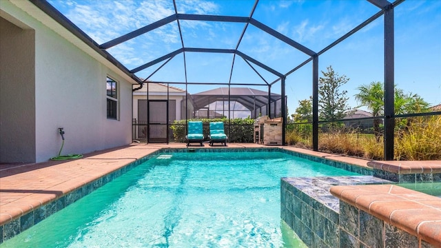 view of pool with a lanai and a patio area