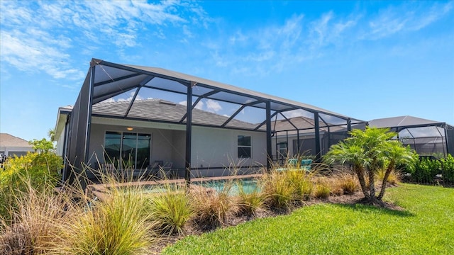 rear view of property with glass enclosure