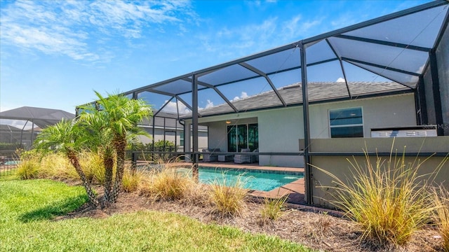 view of pool with a lanai