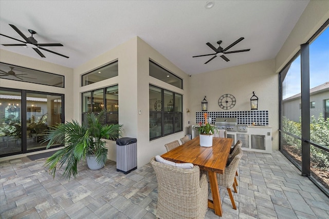 sunroom / solarium with ceiling fan