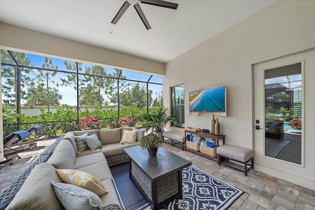 sunroom featuring ceiling fan